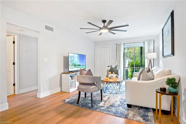 a living room with furniture and a window
