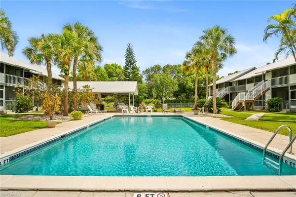 a view of swimming pool with a yard
