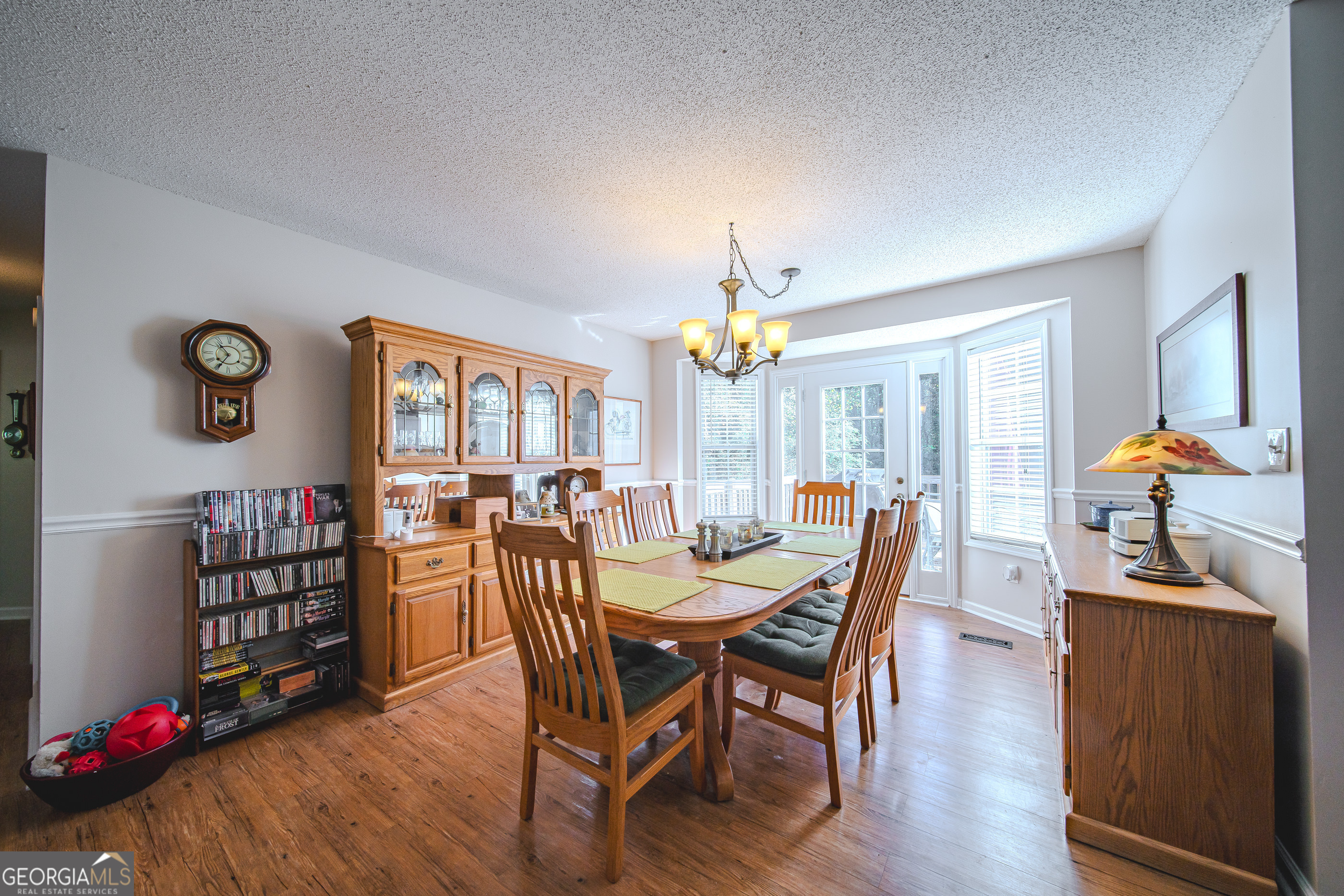 200 Lake Amah Lee Road Hampton, GA 30228 - Photo 13 of 37 a view of a dining room with furniture and wooden floor