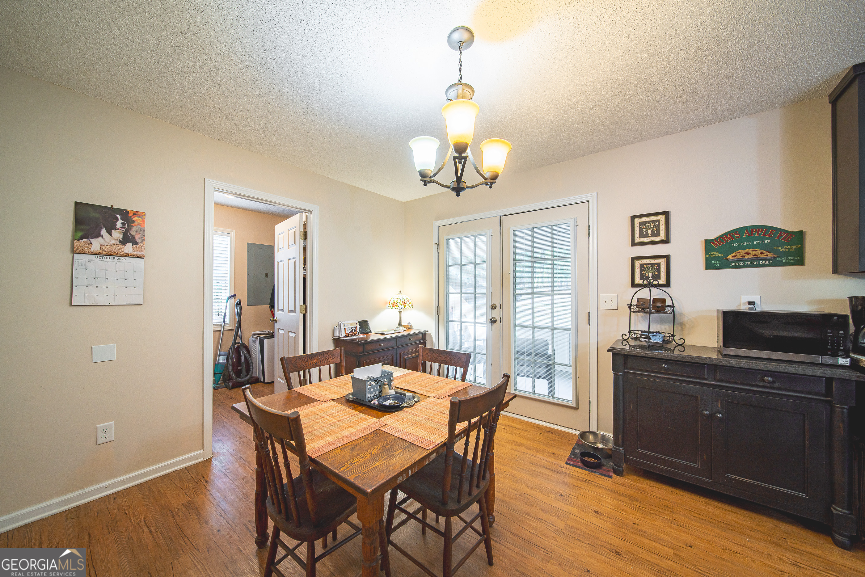 200 Lake Amah Lee Road Hampton, GA 30228 - Photo 18 of 37 a view of a dining room with furniture window and wooden floor