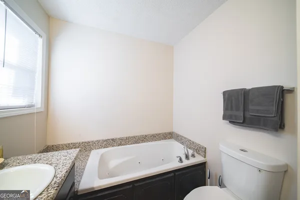 a bathroom with a sink and a toilet