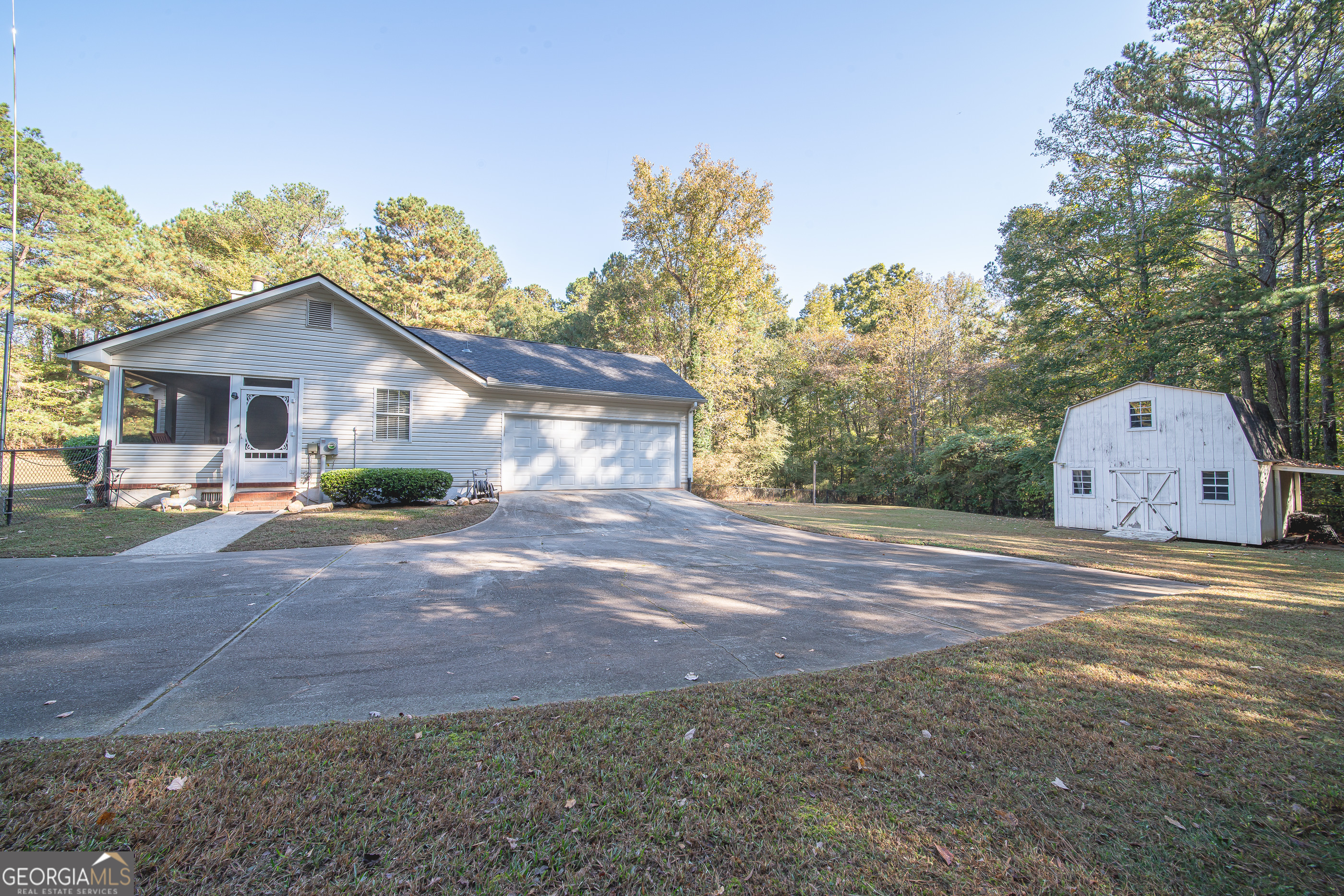 200 Lake Amah Lee Road Hampton, GA 30228 - Photo 34 of 37 a view of a house with a yard and large tree