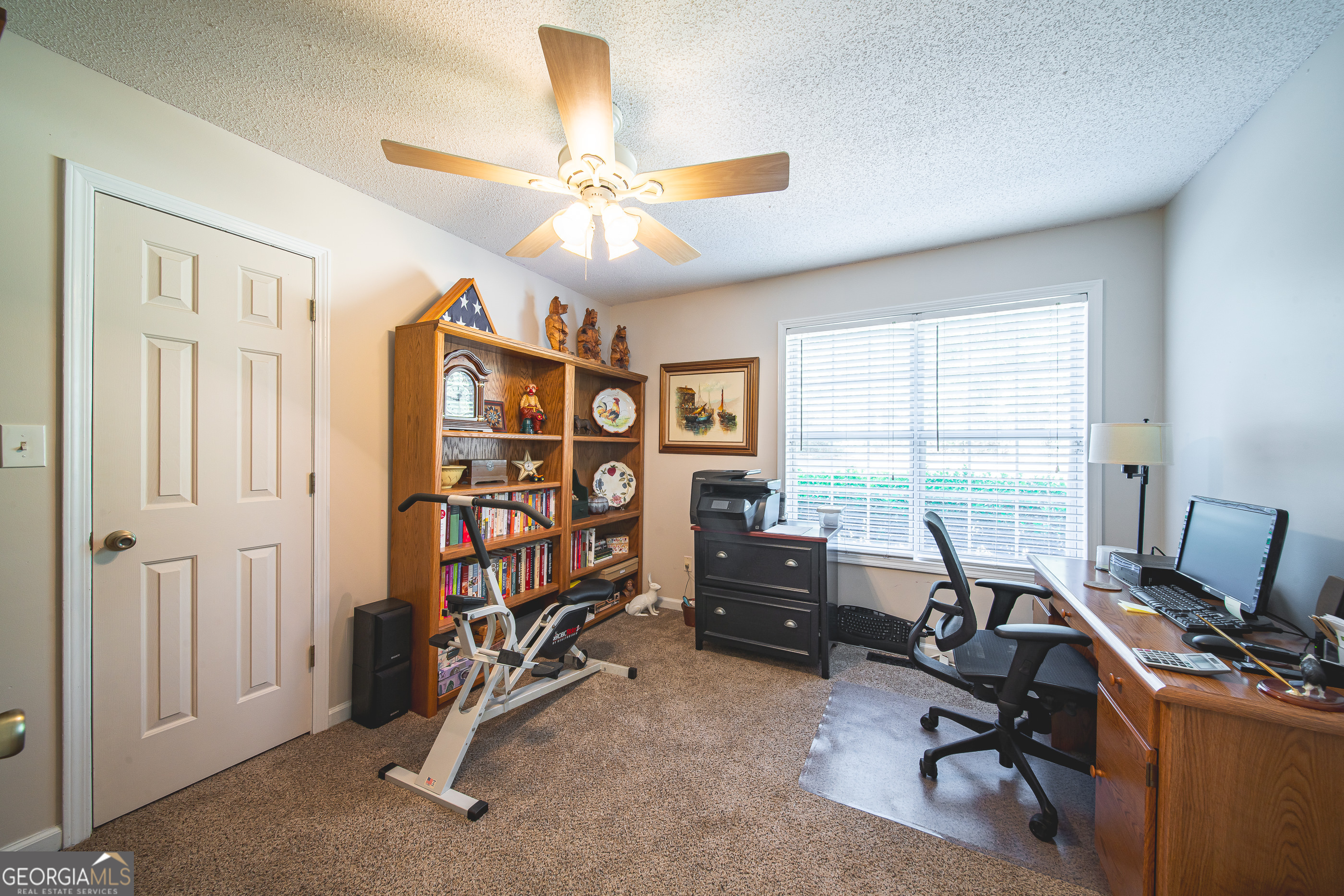 200 Lake Amah Lee Road Hampton, GA 30228 - Photo 7 of 37 a view of a livingroom with workspace and a window