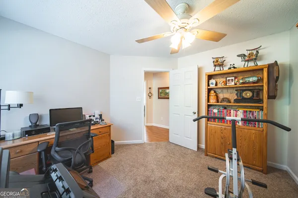 a workspace with furniture and screen