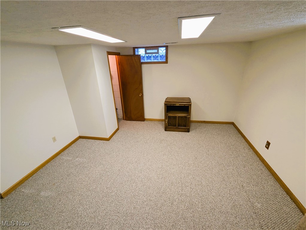1589 Krumroy Road Akron, OH 44306 - Photo 19 of 36 An alcove of the basement that could have a bed. There is a closet here