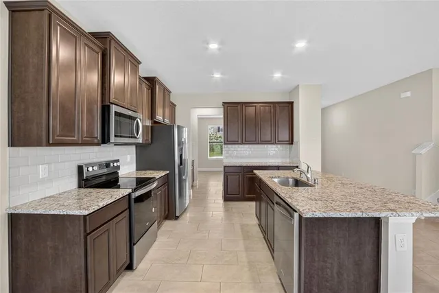 a bathroom with a toilet a sink and a window