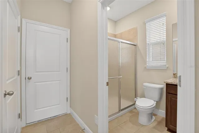 an empty room with a empty space and windows