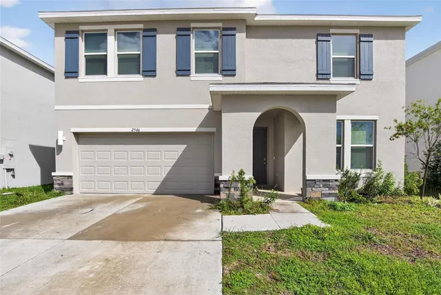 a view of a hallway with wooden shelves