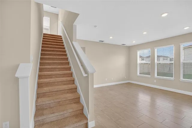 a view of a hallway with a wooden floor