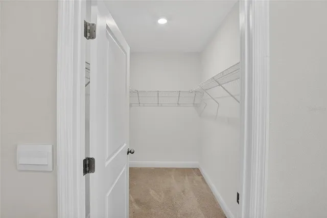 a white bath tub sitting next to a white toilet and a shower