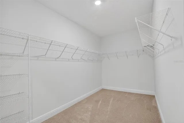 a view of a porch with a big yard and large trees