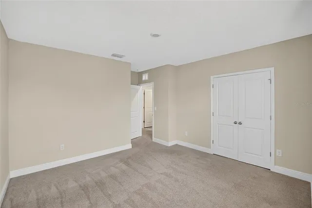 front view of a house with potted plants