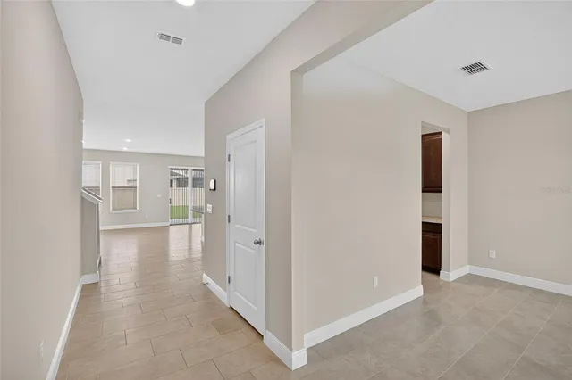a kitchen with a refrigerator and countertop