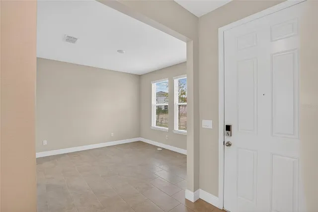 a kitchen with stainless steel appliances granite countertop a sink and a refrigerator
