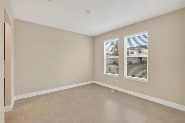 a kitchen with stainless steel appliances granite countertop a stove a sink a refrigerator and a microwave