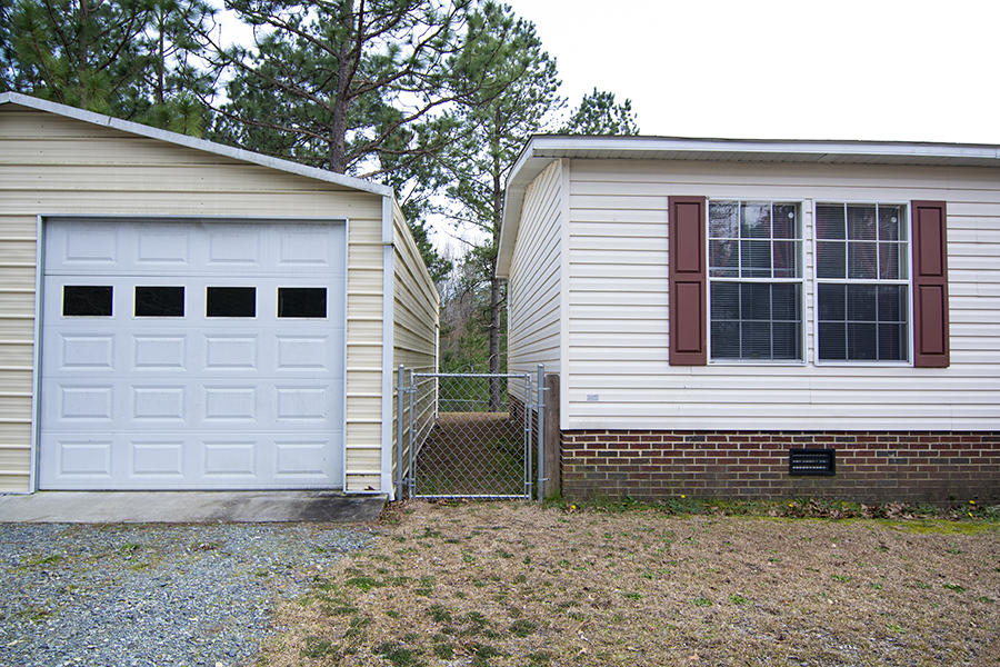 4821 Ashemont Road Aberdeen, NC 28315 - Photo 33 of 40 garage_walkway_house_20919_6847