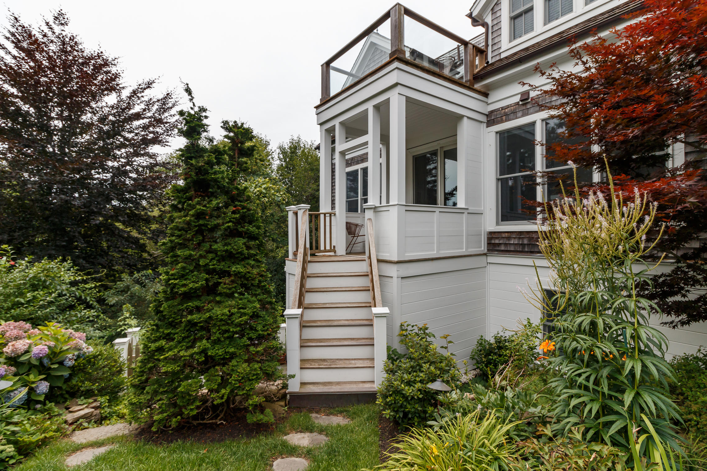 52 Point Street Provincetown, MA 02657 - Photo 14 of 35 a front view of a house with a yard