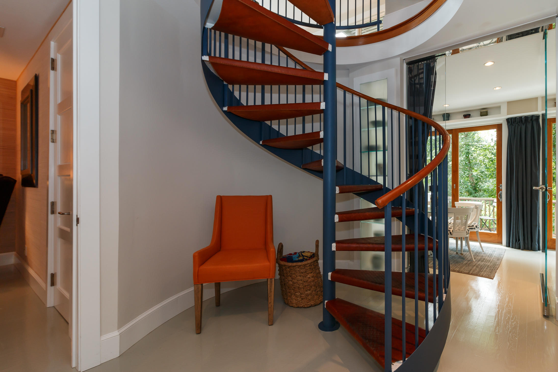 52 Point Street Provincetown, MA 02657 - Photo 16 of 35 a view of staircase with lots of frames on wall and a window