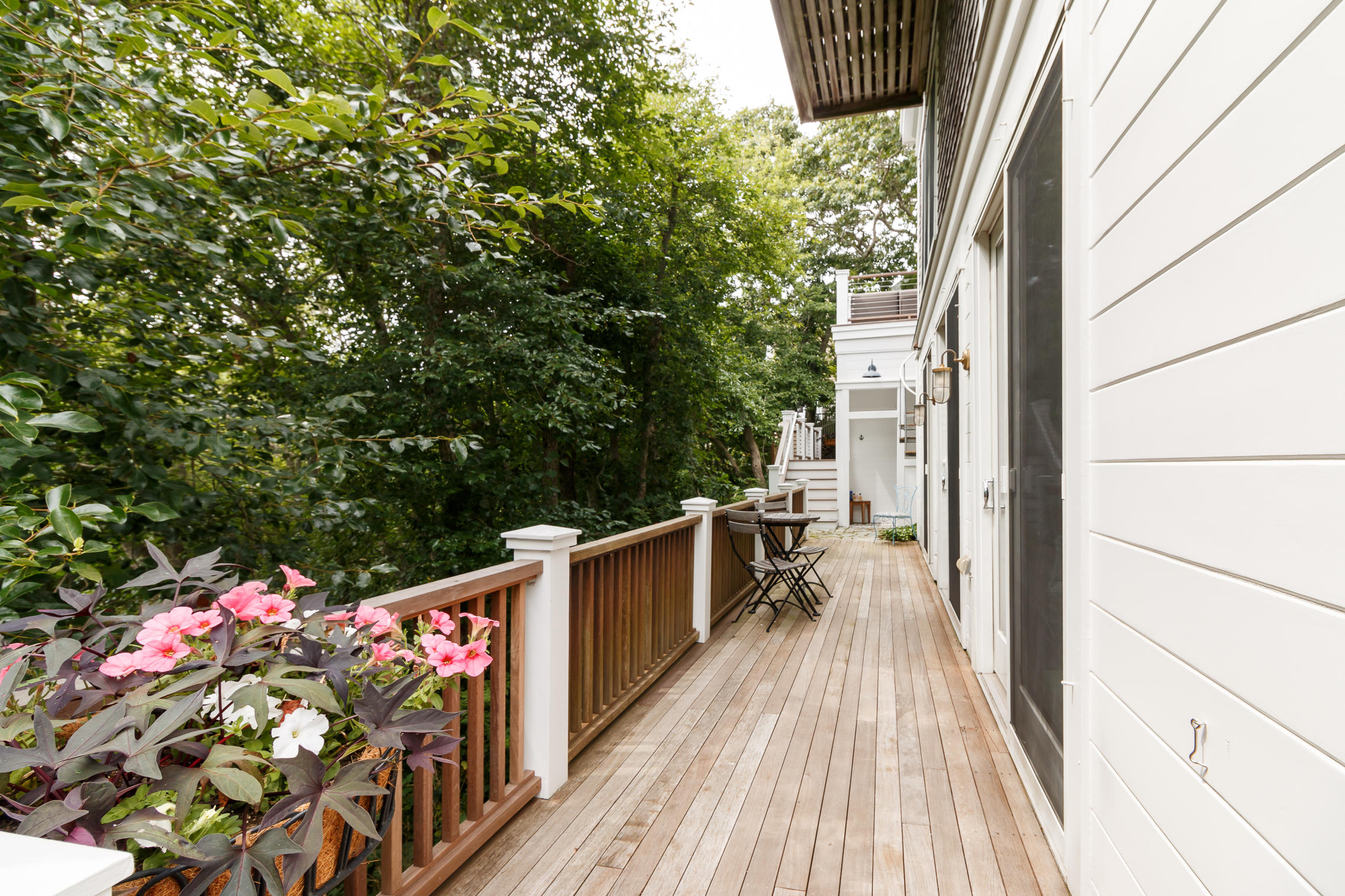 52 Point Street Provincetown, MA 02657 - Photo 21 of 35 a view of a balcony with wooden floor and outdoor space