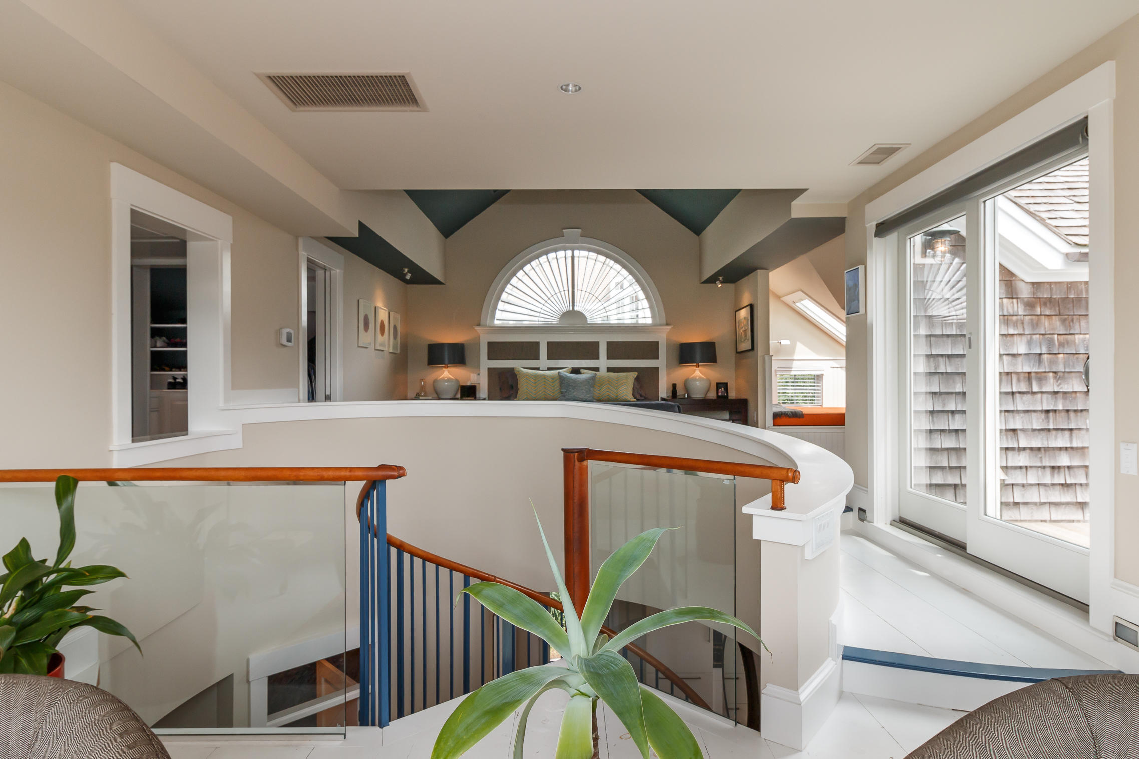 52 Point Street Provincetown, MA 02657 - Photo 24 of 35 a view of entryway with a floor to ceiling window and wooden floor
