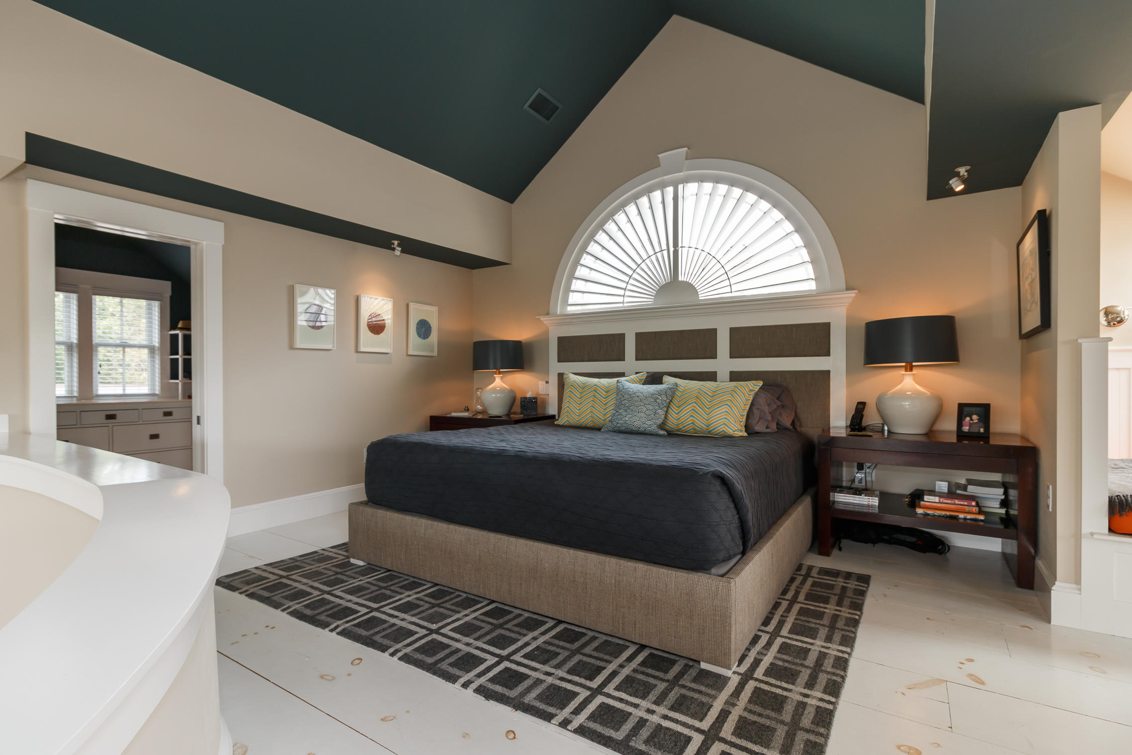 52 Point Street Provincetown, MA 02657 - Photo 27 of 35 a bedroom with a large bed and a window