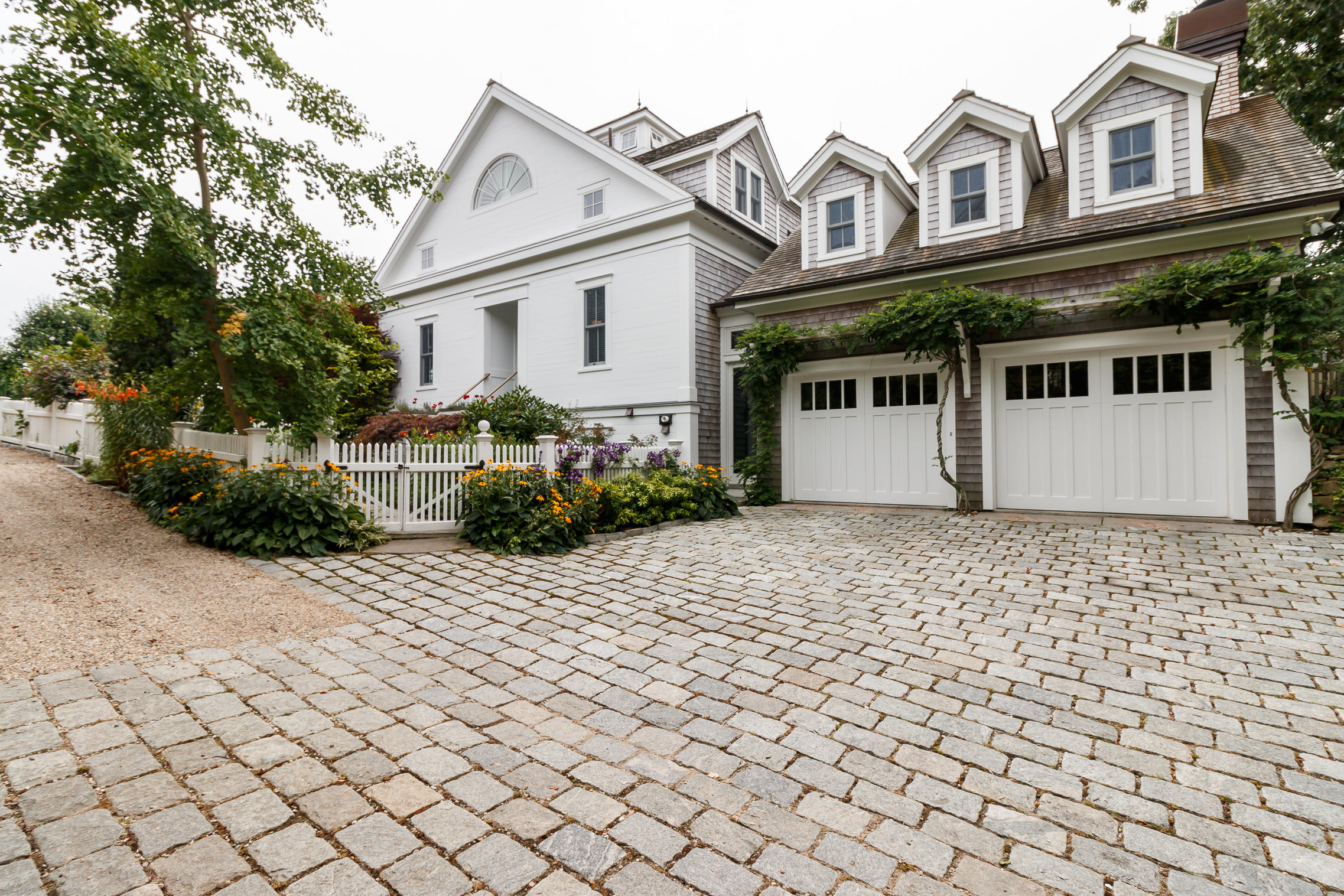 52 Point Street Provincetown, MA 02657 - Photo 4 of 35 a view of a white house with large windows