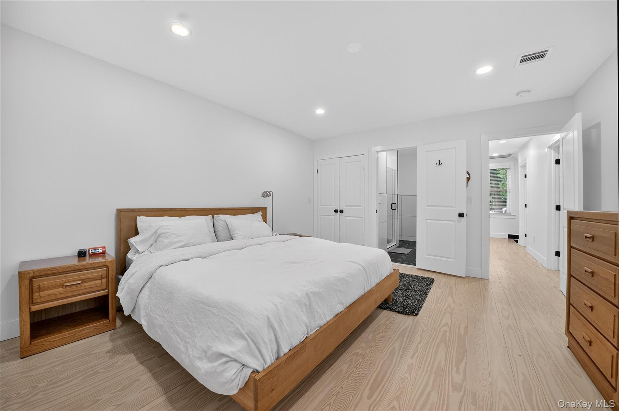 39 Frost Lane Cornwall, NY 12518 - Photo 16 of 39 a spacious bedroom with a bed and a wooden floor