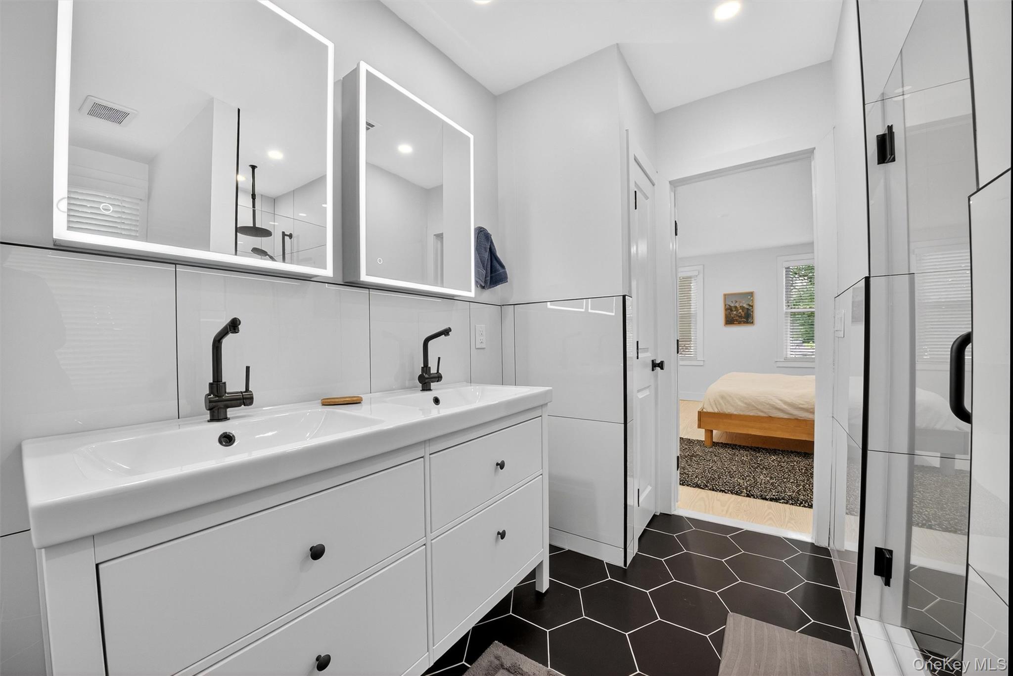 39 Frost Lane Cornwall, NY 12518 - Photo 18 of 39 a en suite bathroom with a double vanity sink a mirror and shower