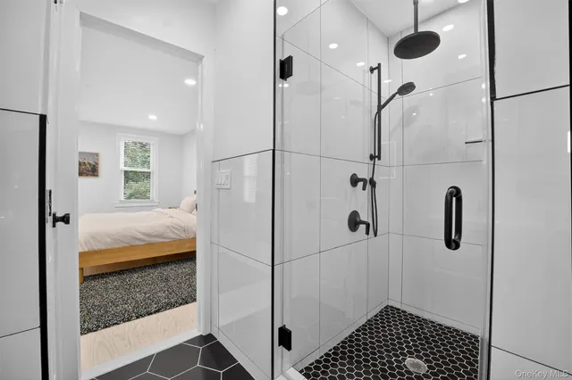 a bathroom with a shower and a sink