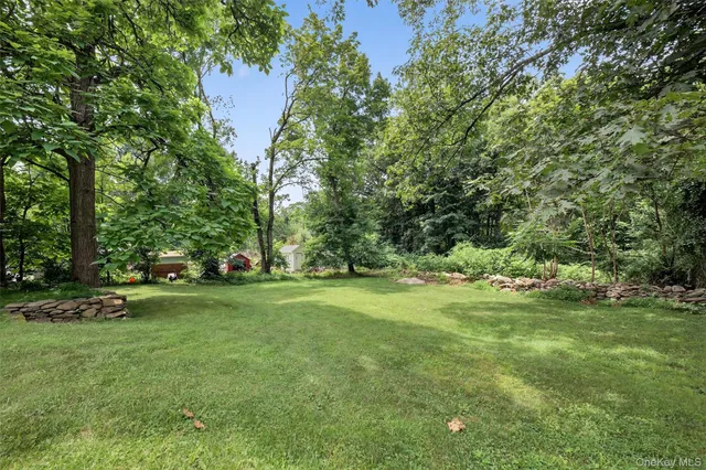 an aerial view of a house with yard