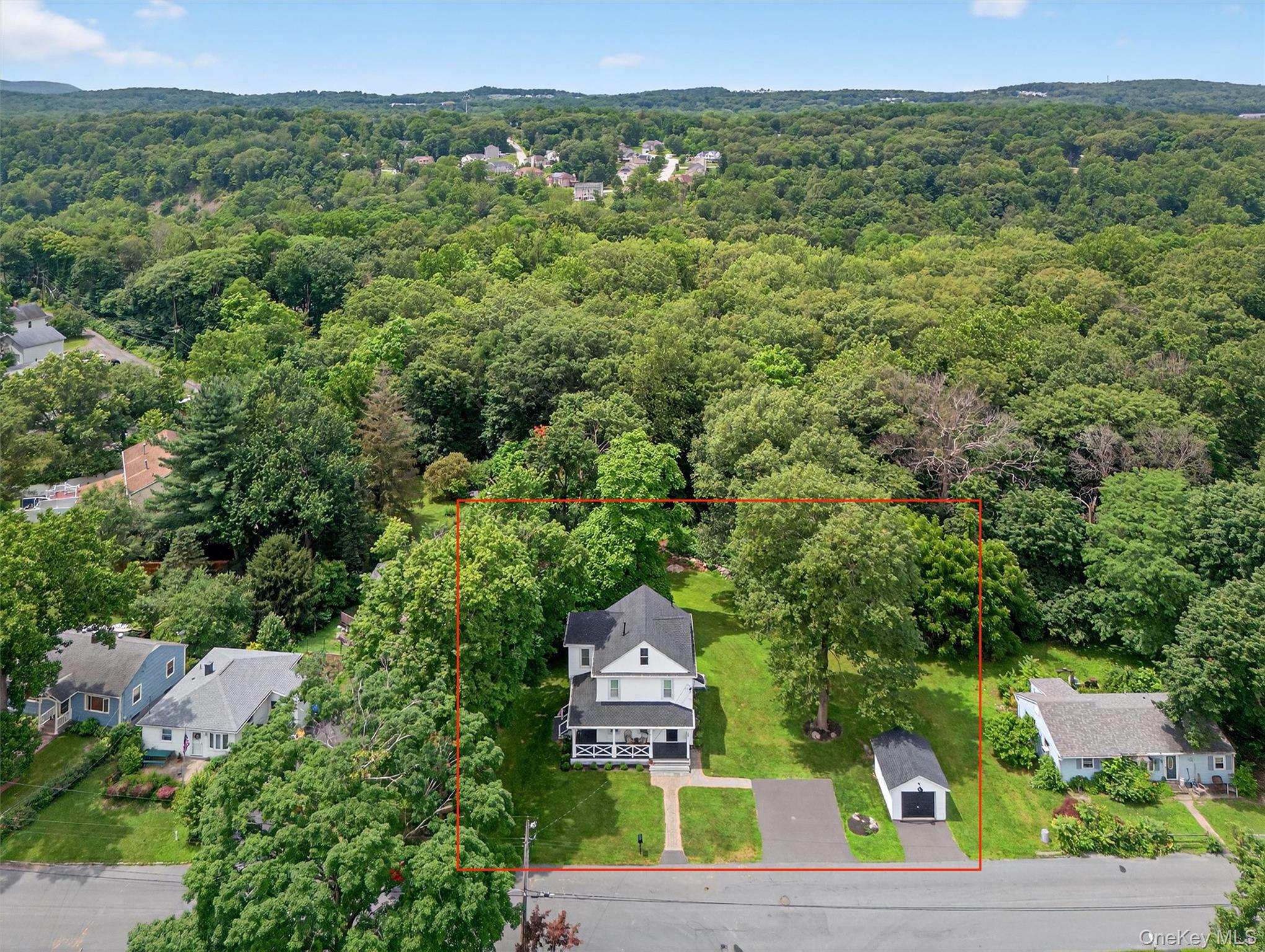 39 Frost Lane Cornwall, NY 12518 - Photo 34 of 39 an aerial view of a house with a green yard