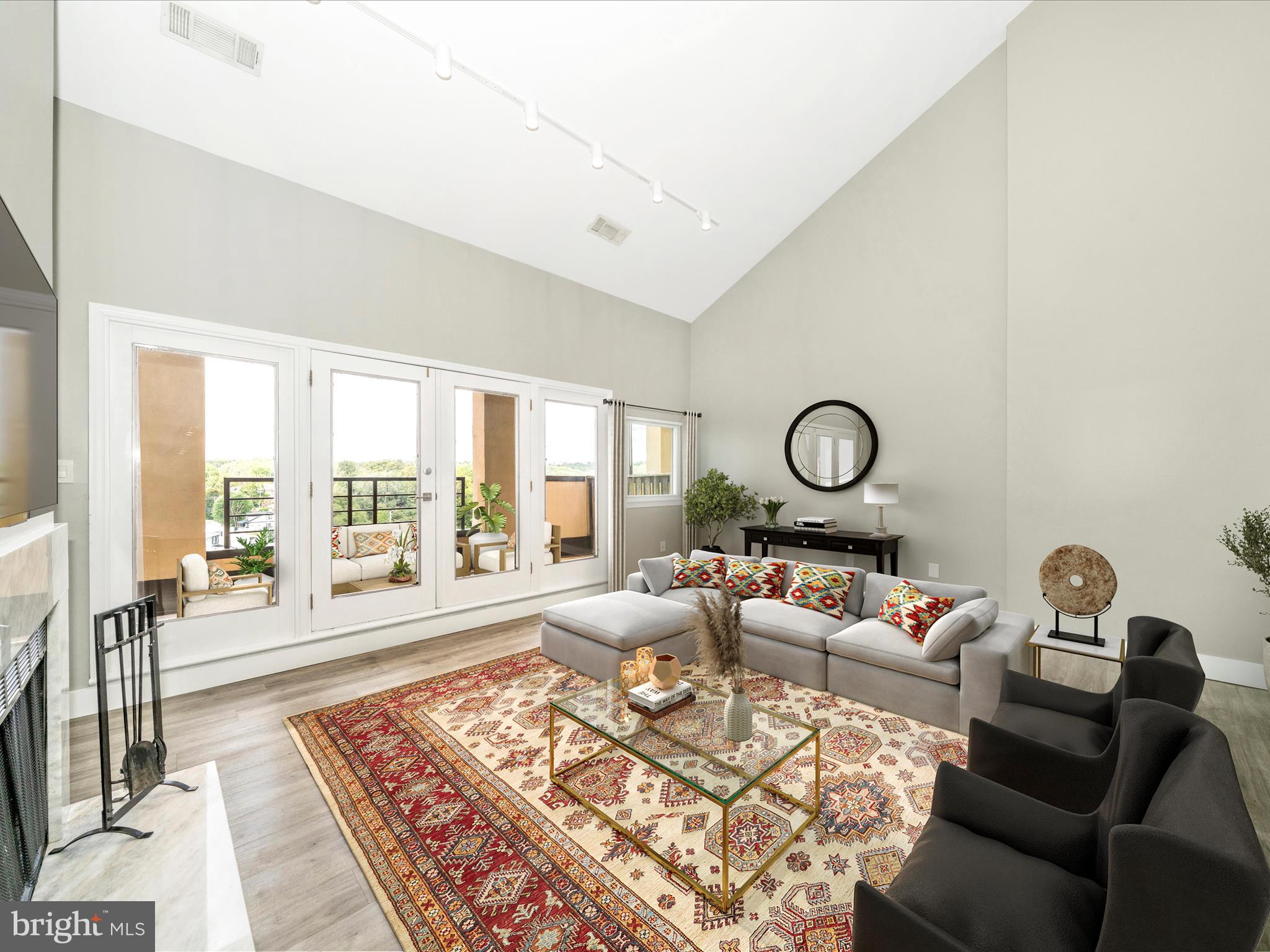 1040 Deer Ridge Drive, Unit 508 Baltimore, MD 21210 - Photo 23 of 66 a living room with furniture and a large window