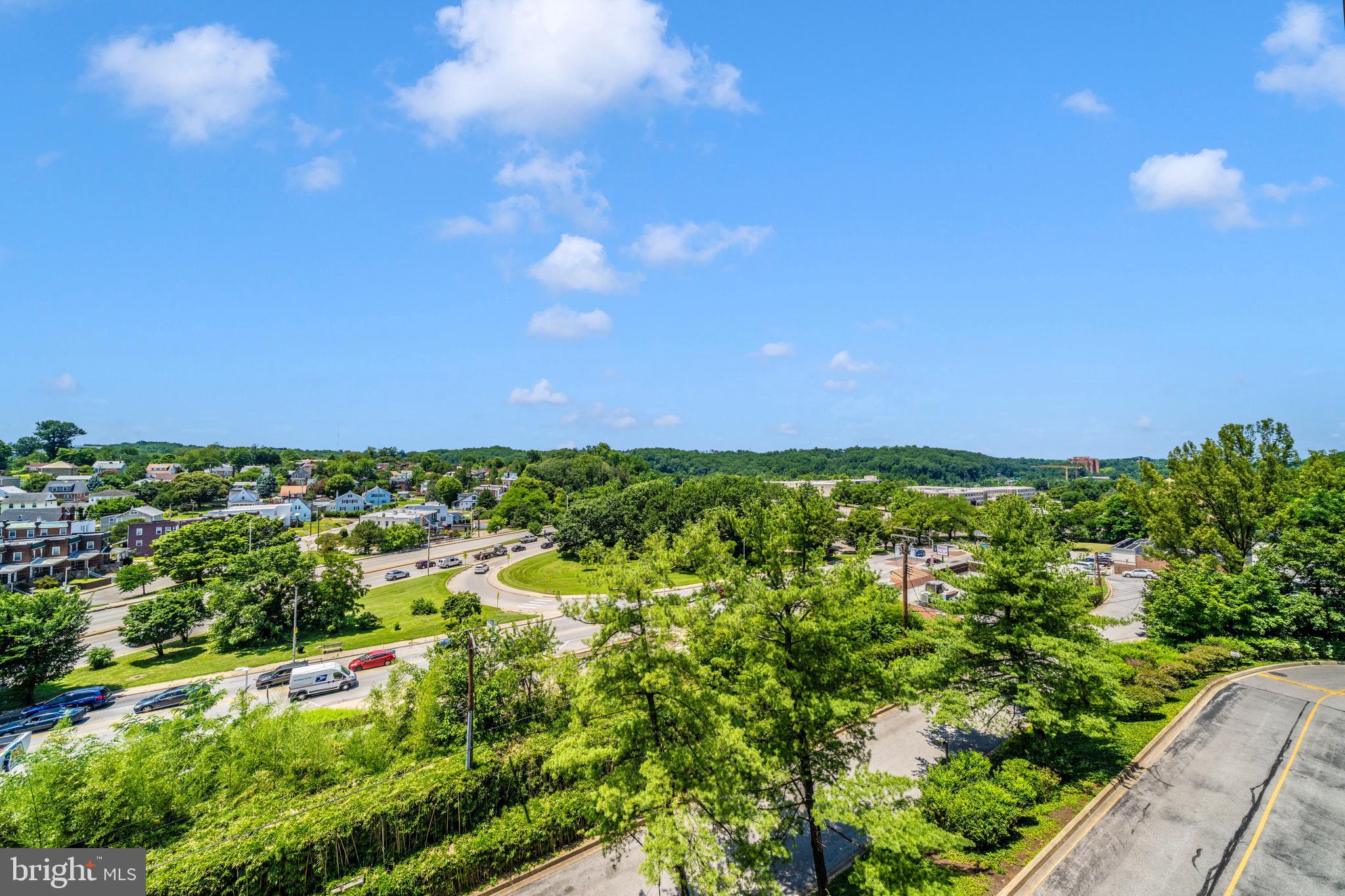 1040 Deer Ridge Drive, Unit 508 Baltimore, MD 21210 - Photo 31 of 66 a view of a green field with lots of bushes