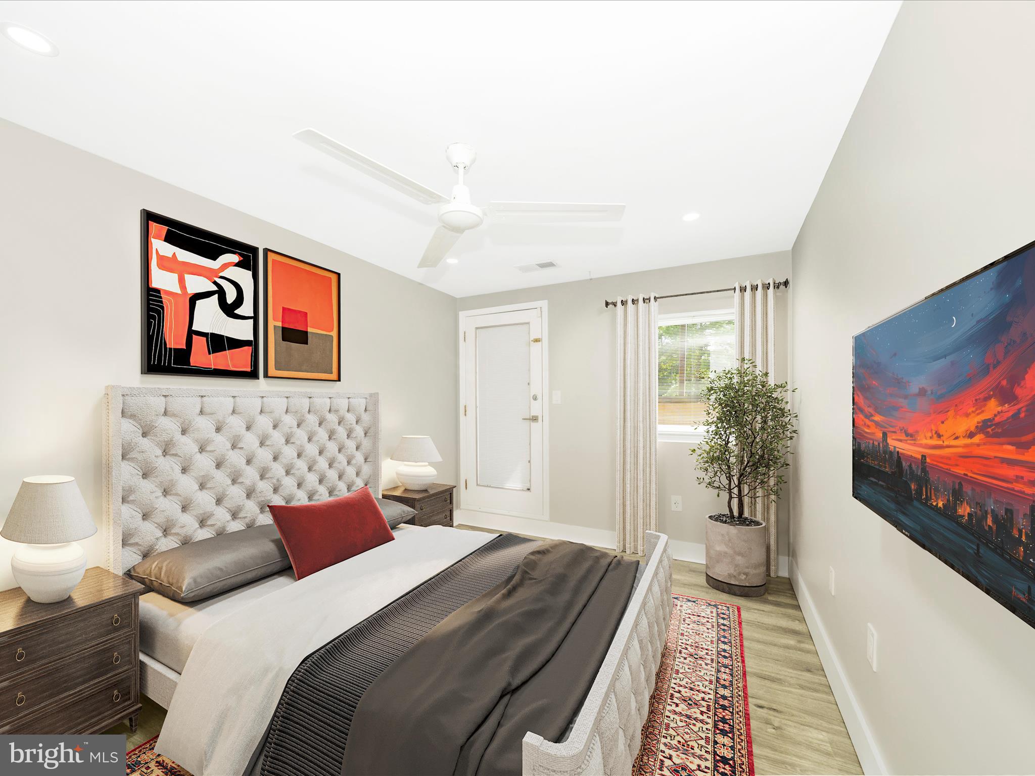 1040 Deer Ridge Drive, Unit 508 Baltimore, MD 21210 - Photo 40 of 66 a bedroom with a bed and a flat screen tv