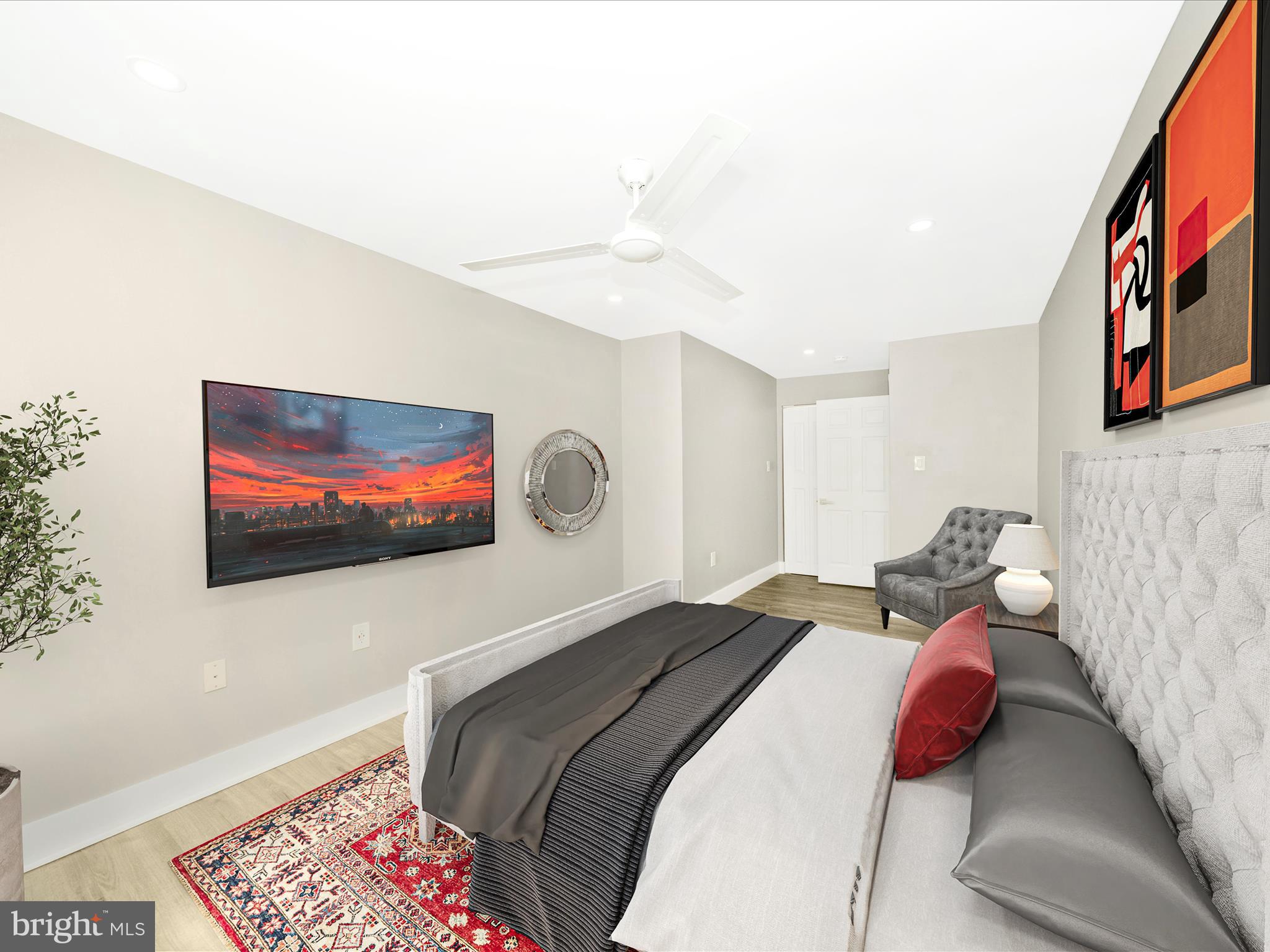 1040 Deer Ridge Drive, Unit 508 Baltimore, MD 21210 - Photo 42 of 66 a bedroom with a bed and a flat screen tv