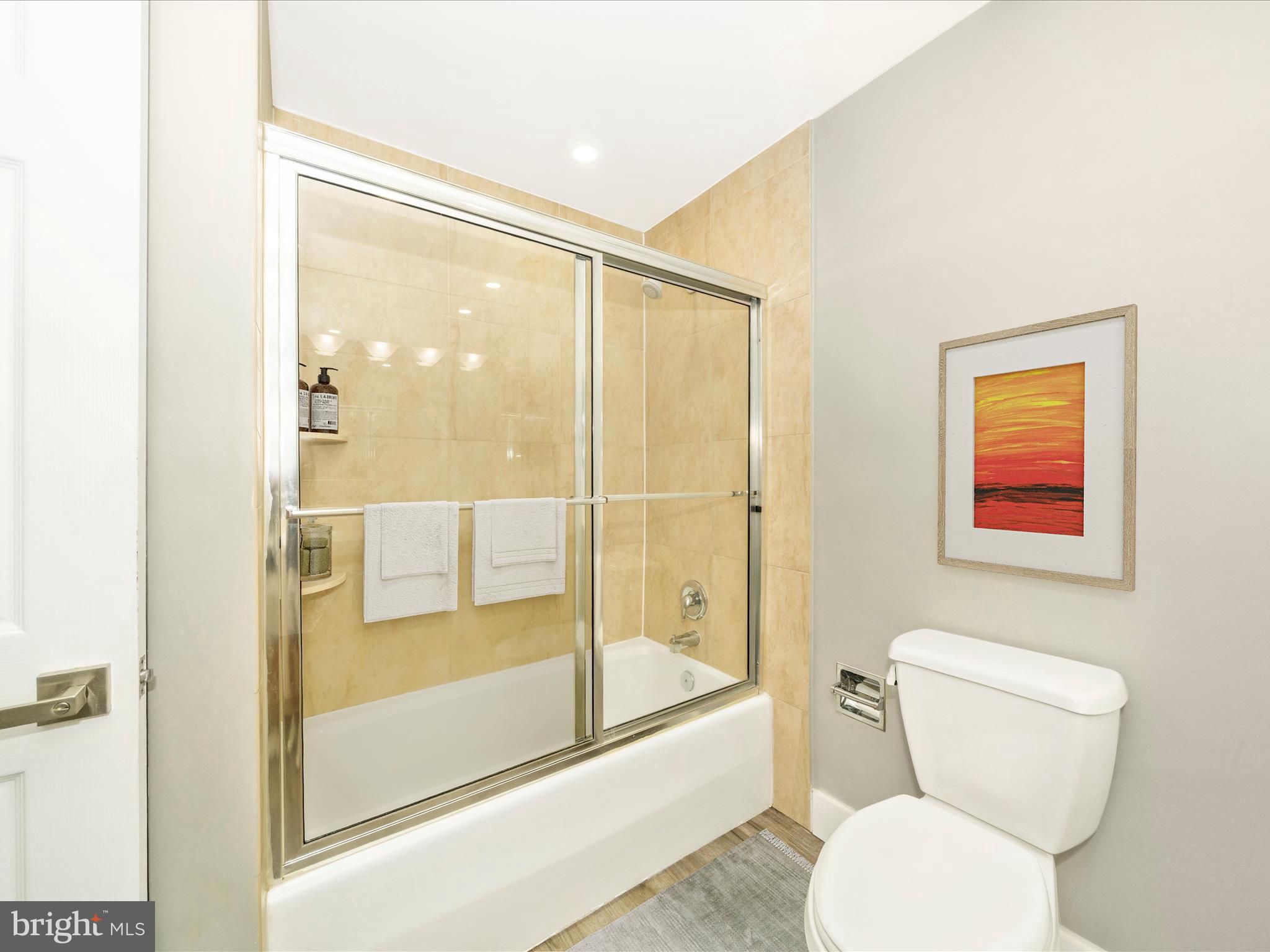 1040 Deer Ridge Drive, Unit 508 Baltimore, MD 21210 - Photo 49 of 66 a bathroom with a toilet and a shower