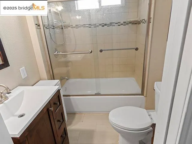 a bathroom with a sink a toilet and a shower