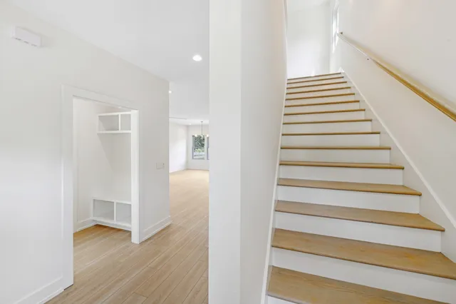 a view of an entryway with wooden floor