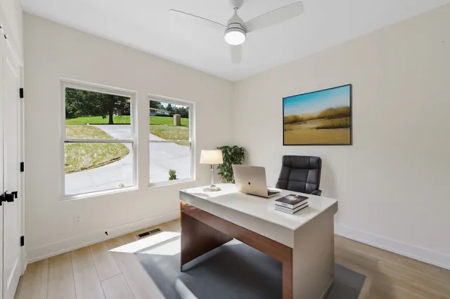 a work room with furniture and a window