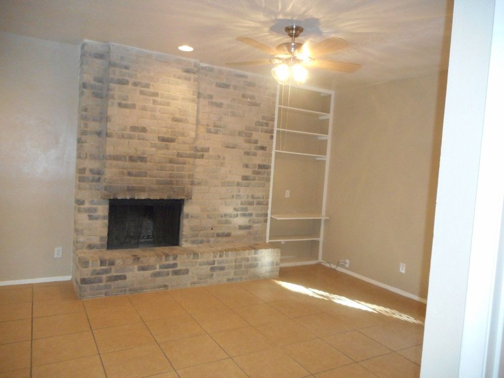 3106 Cedar Street Austin, TX 78705 - Photo 9 of 19 Unfurnished living room featuring a fireplace, tile patterned floors, a ceiling fan, and recessed lighting