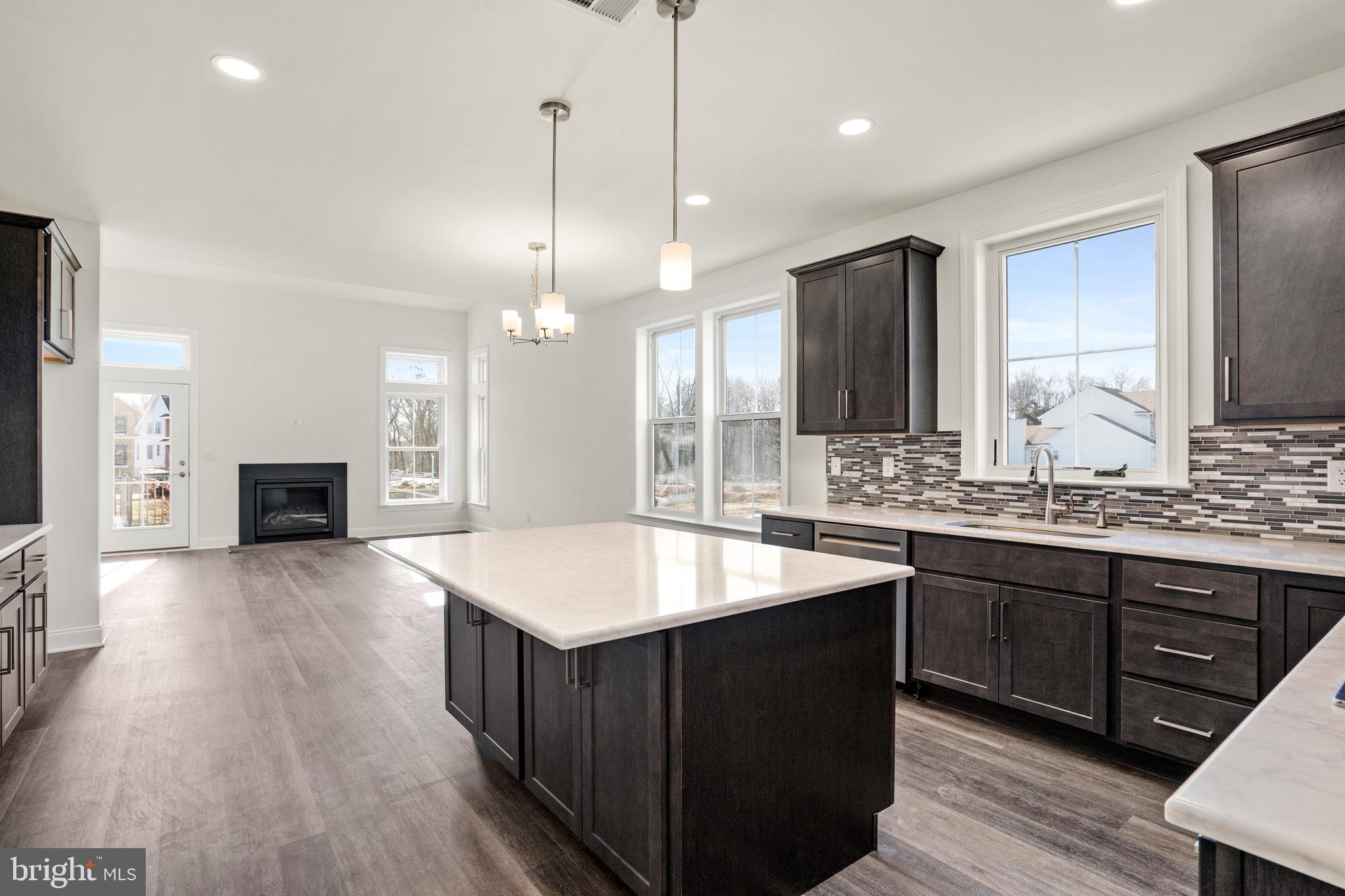 33 Kay Chiarello Way Hamilton, NJ 08690 - Photo 11 of 42 a large kitchen with kitchen island a island a sink a stove and wooden floor