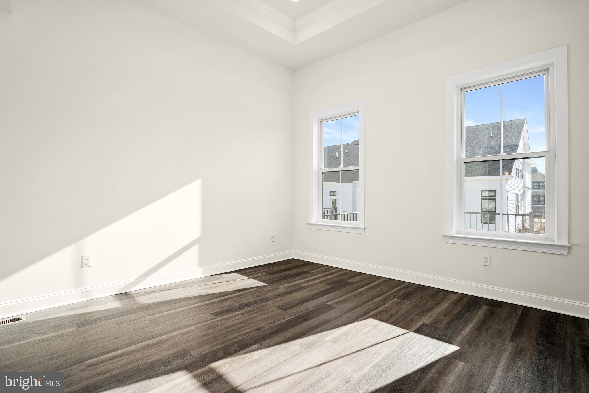 33 Kay Chiarello Way Hamilton, NJ 08690 - Photo 16 of 42 a view of an empty room with wooden floor and a window