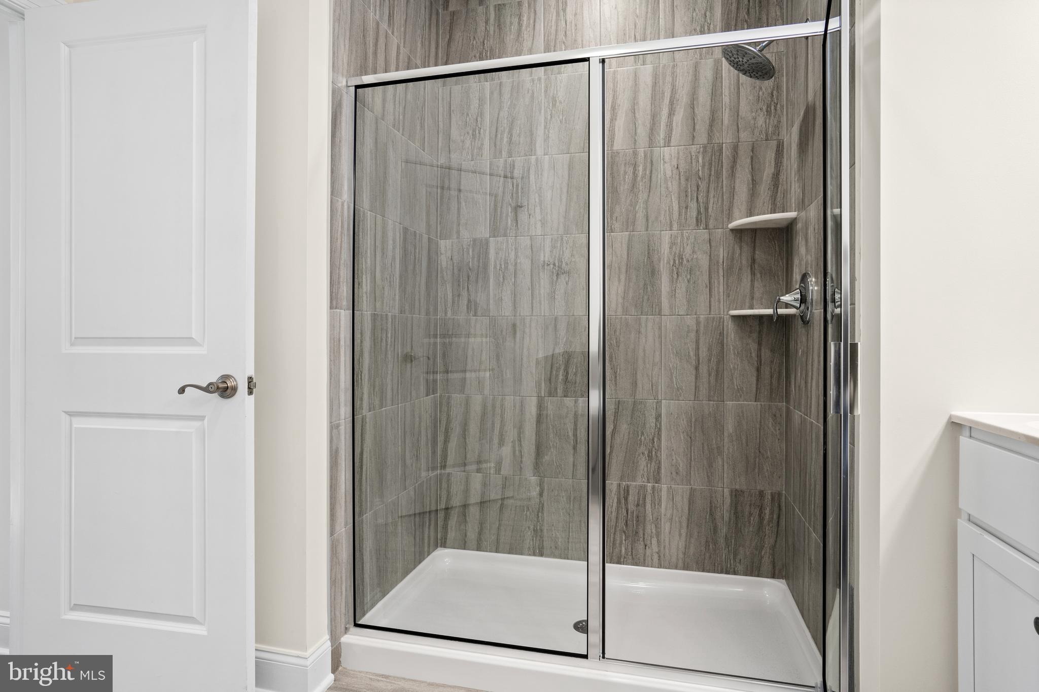 33 Kay Chiarello Way Hamilton, NJ 08690 - Photo 19 of 42 a bathroom with a glass shower door