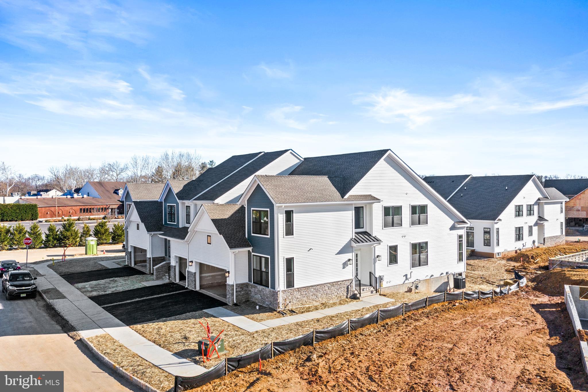33 Kay Chiarello Way Hamilton, NJ 08690 - Photo 28 of 42 a view of a white house next to a yard with wooden fence