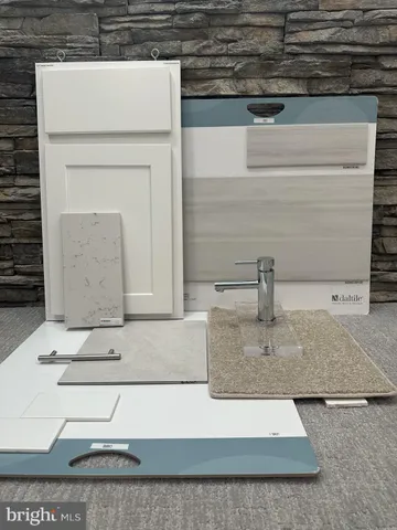 a kitchen with sink and white cabinets