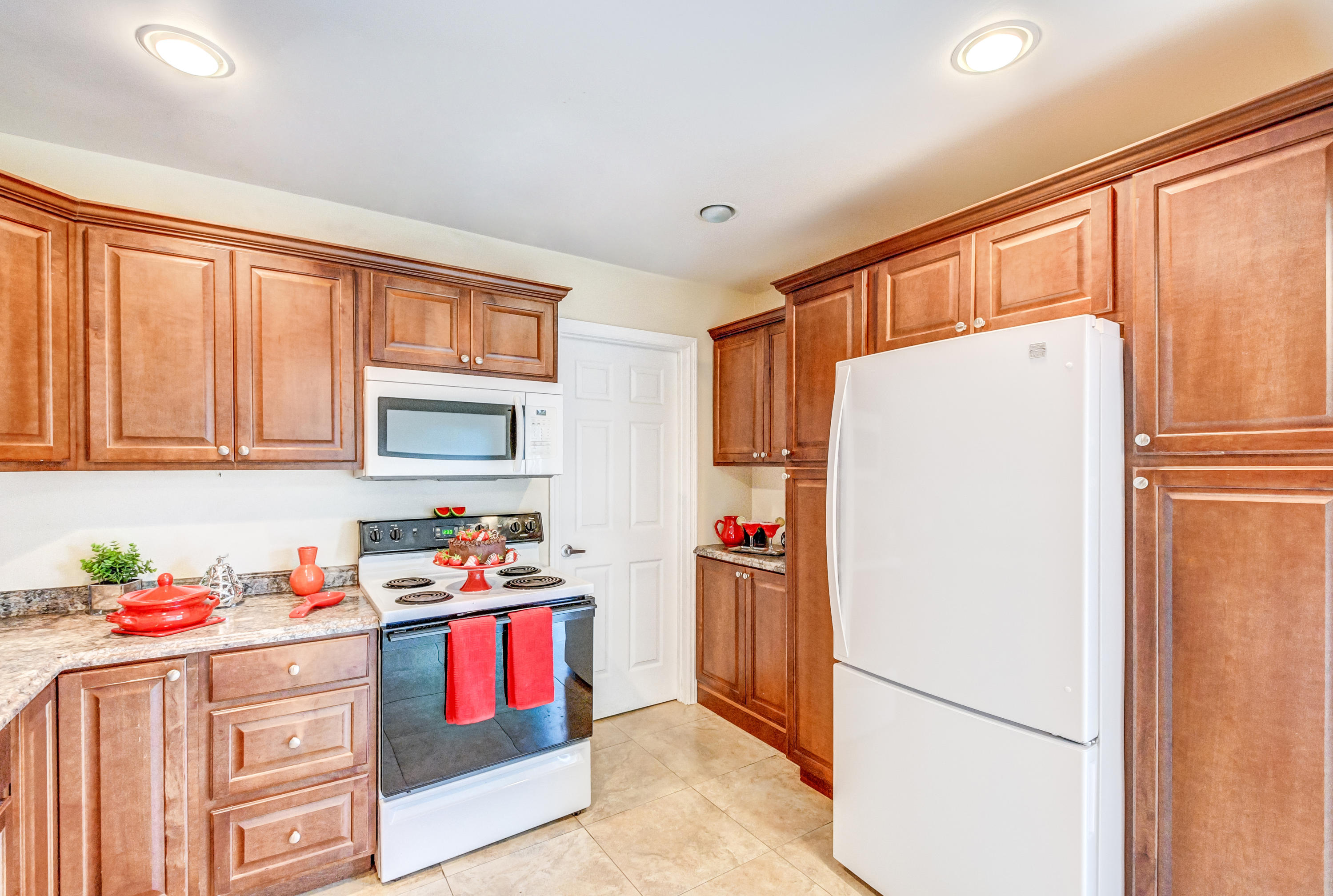 19594 Liberty Road Boca Raton, FL 33434 - Photo 17 of 53 a kitchen with stainless steel appliances a refrigerator sink and cabinets
