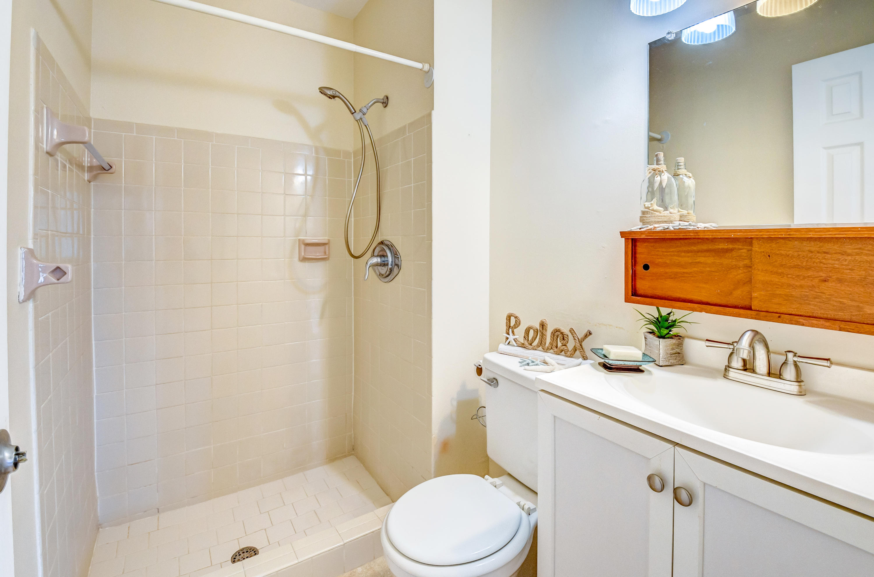 19594 Liberty Road Boca Raton, FL 33434 - Photo 29 of 53 a bathroom with a sink a toilet and shower