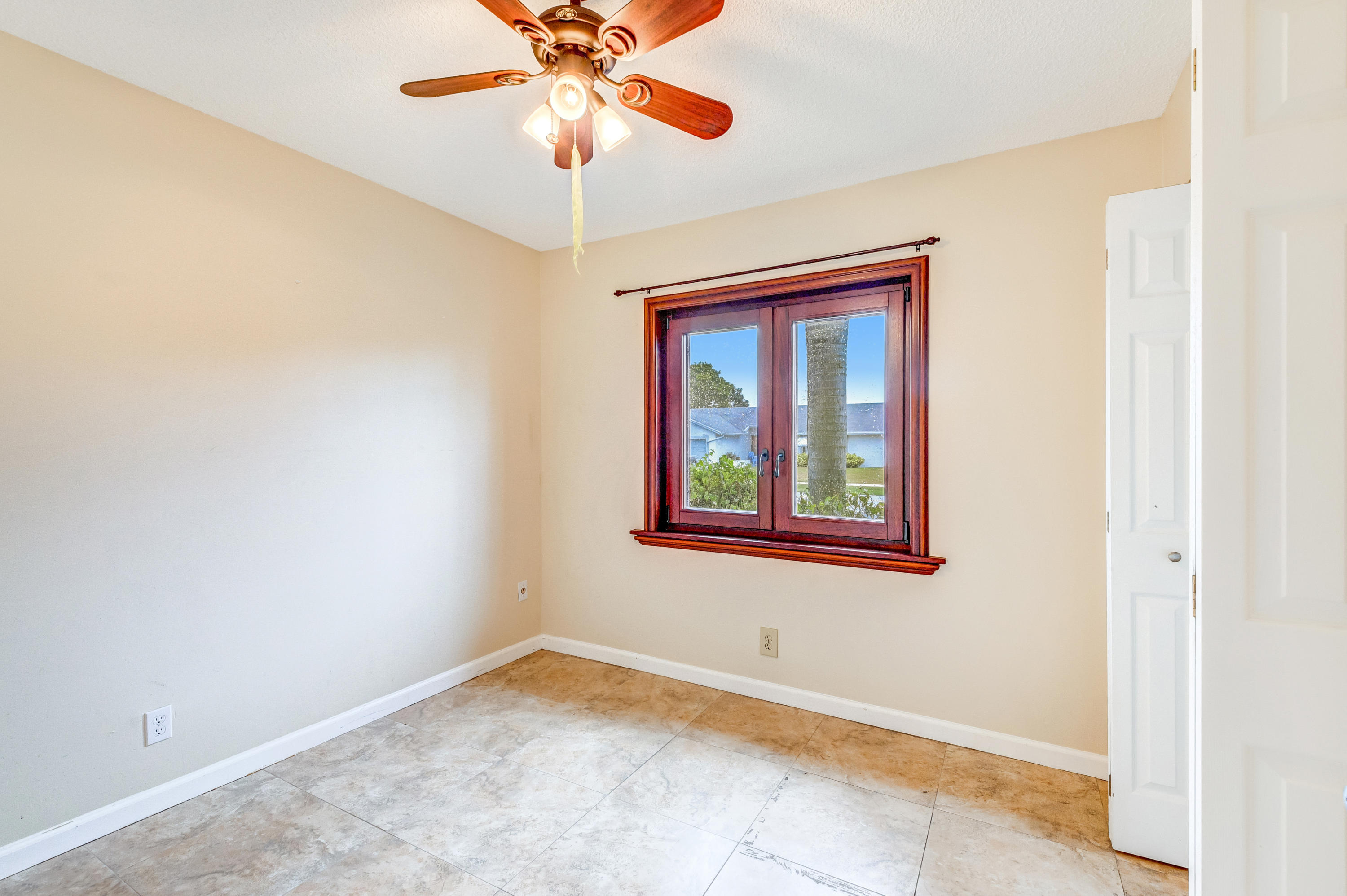 19594 Liberty Road Boca Raton, FL 33434 - Photo 30 of 53 an empty room with window and fan
