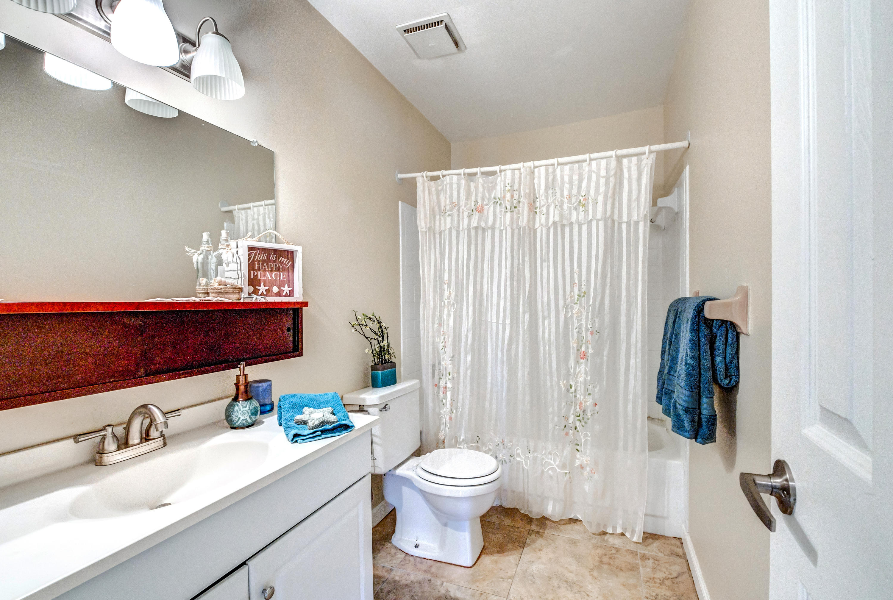 19594 Liberty Road Boca Raton, FL 33434 - Photo 33 of 53 a bathroom with a granite countertop sink a toilet and a mirror