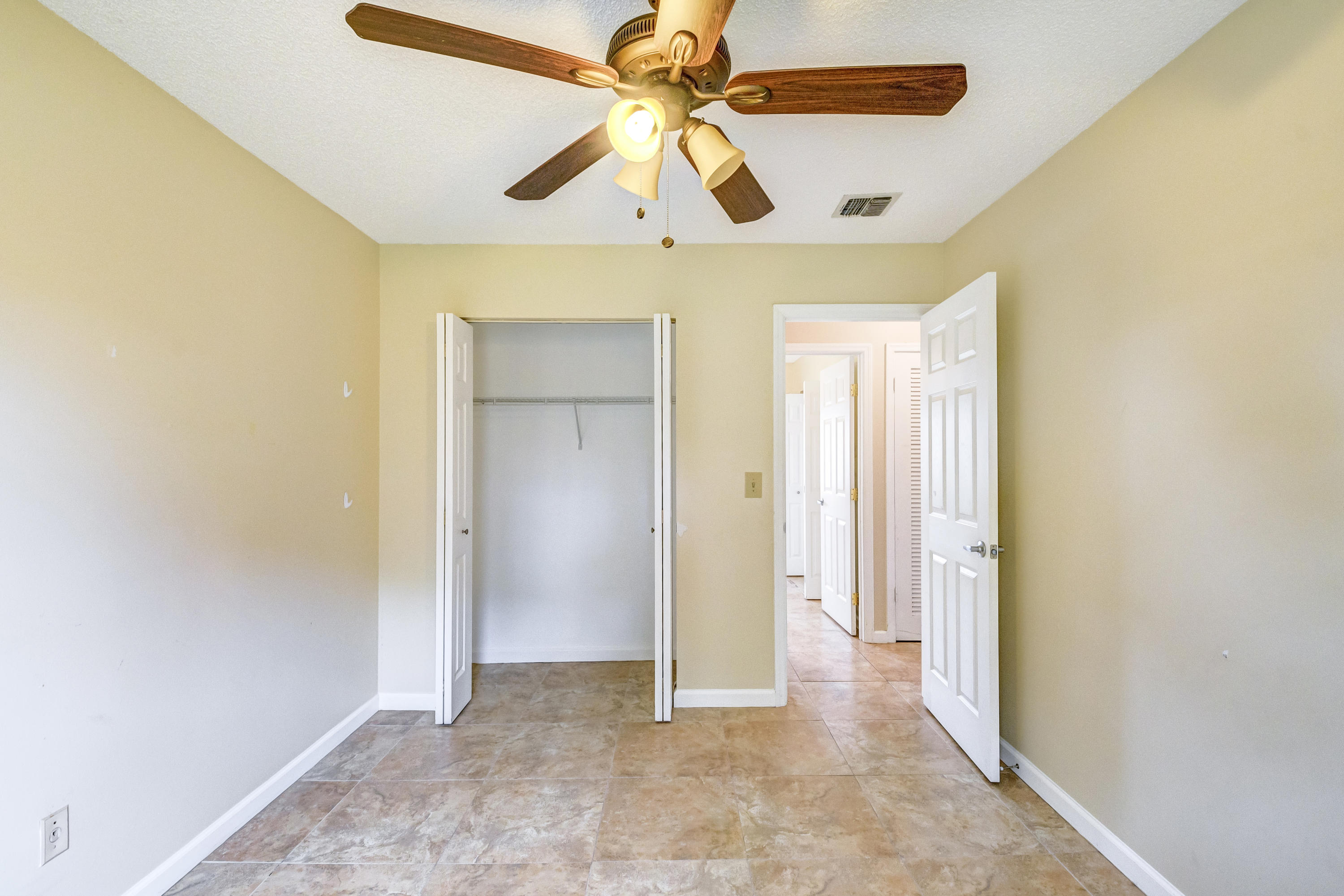 19594 Liberty Road Boca Raton, FL 33434 - Photo 35 of 53 a view of a ceiling fan and a bathroom